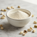 Premium white cardamom powder in ceramic bowl with whole white cardamom pods